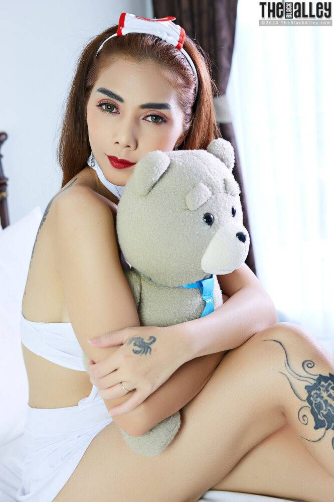 Redheaded Asian beauty Carolinafong holds a plush toy before exposing herself - #2