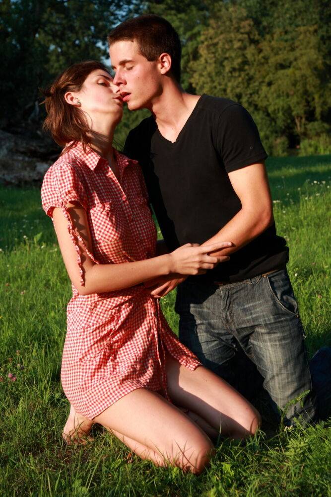 Young couple have sexual intercourse in a grassy field near a gnarly tree - #5