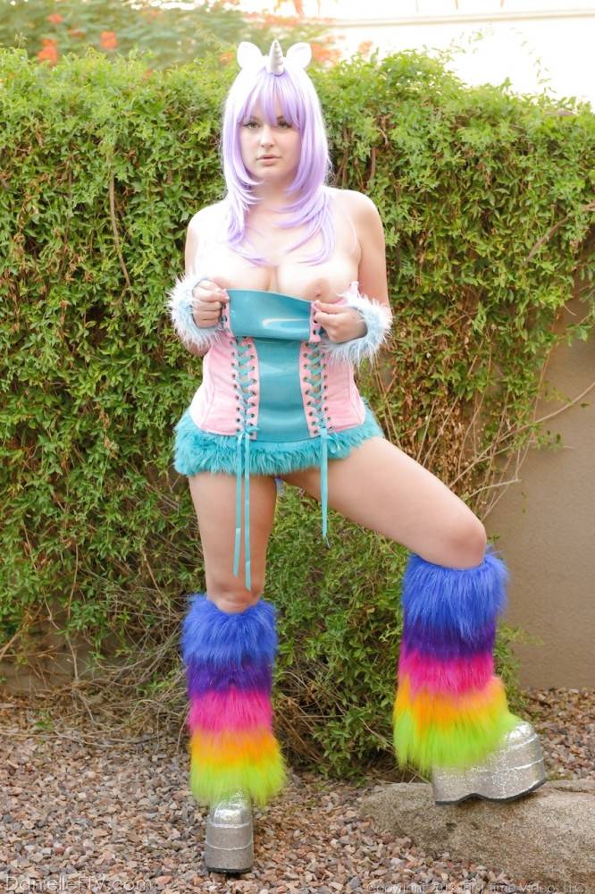 Excellent hottie Danielle Delaunay in cosplay costume baring big hooters and toying her pussy outdoor - #6