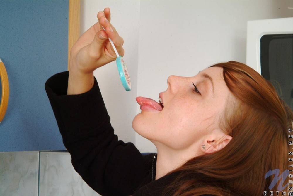 Red Haired Teen Babe Beth Nubiles Slowly Strips While Eating A Lollipop. - #3