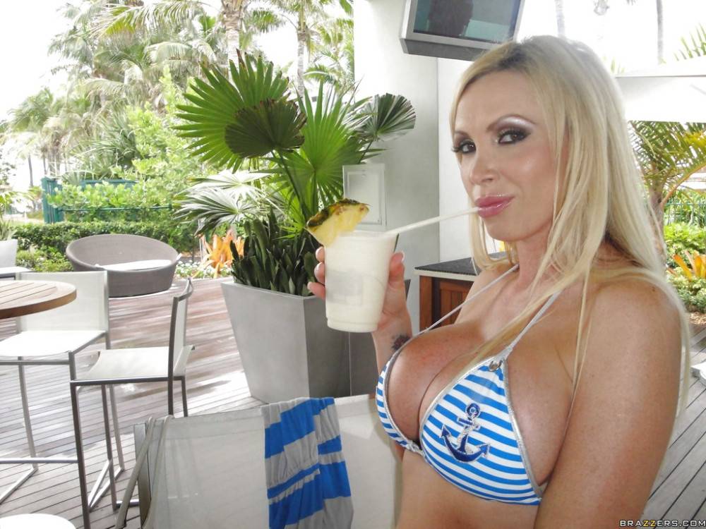 Appealing canadian pornstar Nikki Benz bares big tits and sexy butt at beach - #11