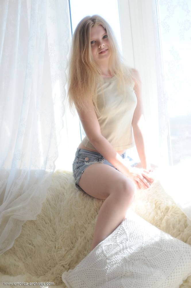 Fair skinned teen Kisa removes jean shorts for totally nude solo poses - #1