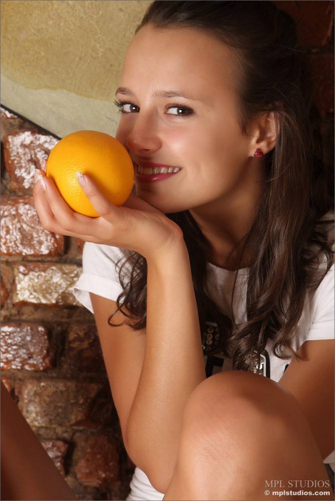 Margarita Mone Got On Wooden Chest Yellow Cloth Got The Orange In Her Hand And Smoothly Taking Off Her Clothes - #2