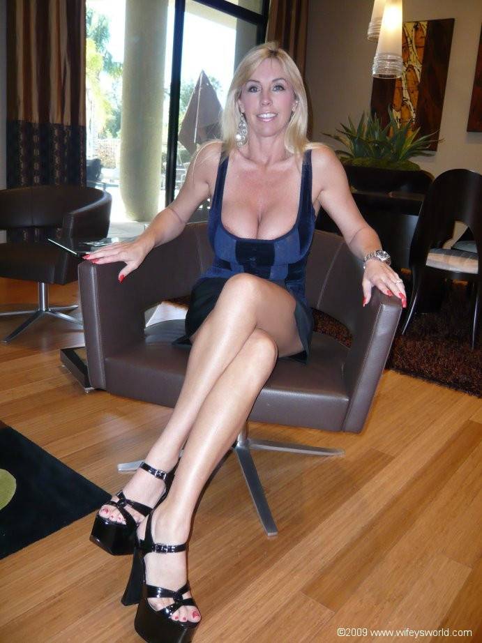 Peachy american wife Sandra Otterson in nice skirt exhibits big hooters and hot ass - #2