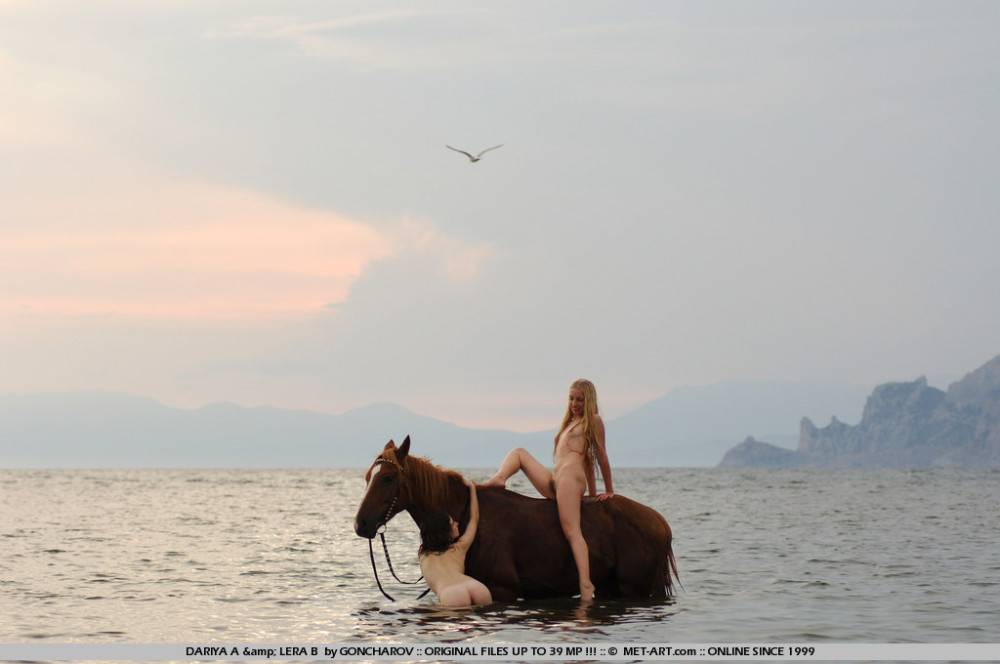 Naked Slender Lesbian Friends Dariya A And Lera B Ride The Horse Naked Together At The Seaside - #1