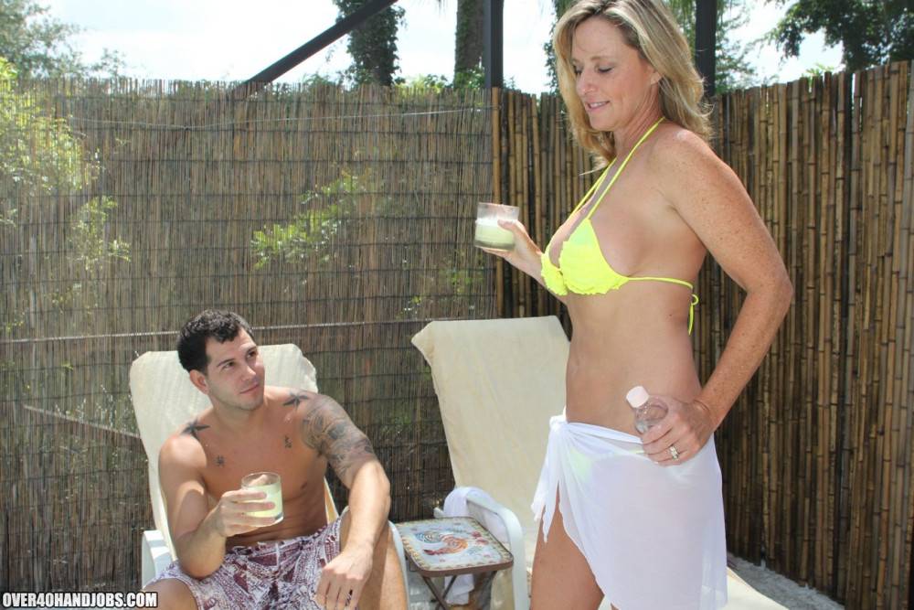 Busty Blonde MILF Jodi West Wraps Her Arms Around A Young Stud And Blows His Boner Poolside. - #1