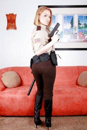 Hot babe in police uniform Krissy Lynn stripping and spreading her legs on picsofsex.com