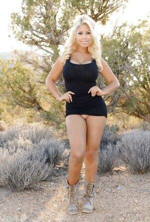 Blonde Bridgette B. shows her nice juicy booty outdoors in the desert on picsofsex.com