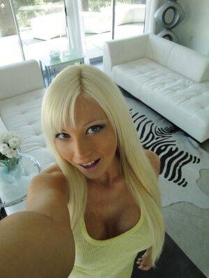 Blonde hottie with big tits Rikki Six stripping and picturing herself on picsofsex.com