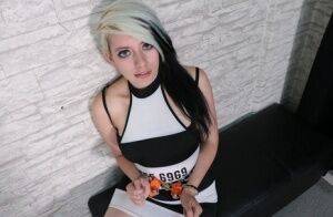 White girl with dyed hair is held prisoner in chains and security cuffs on picsofsex.com