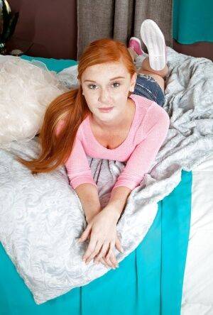Redheaded babe Alex Tanner toying teen pussy while masturbating on picsofsex.com