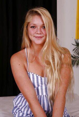 Blonde cutie Jessie Andrews flashing trimmed teen pussy in barefeet on picsofsex.com