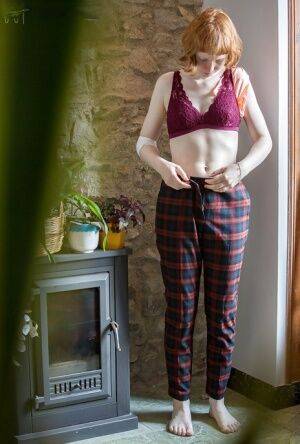 Skinny redheaded chick Emma B recorded getting dressed by hidden camera on picsofsex.com
