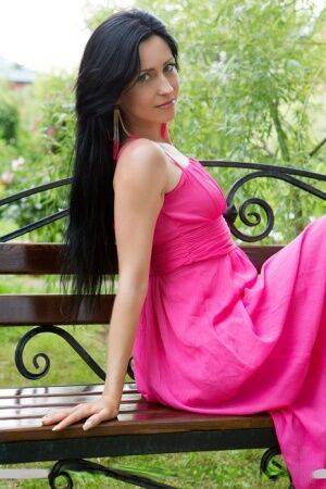 Skinny dark haired glamour babe Janelle B spreading bald teen cunt outdoors on picsofsex.com