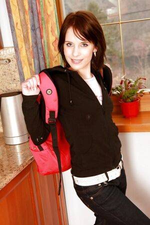 Nasty teen stripping down and toying her twat in the kitchen on picsofsex.com