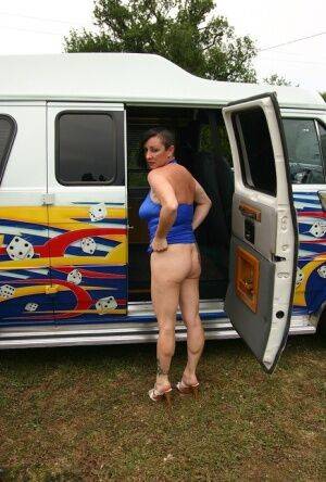 Mature amateur Mary Bitch gets naked inside a B-class van during solo action on picsofsex.com