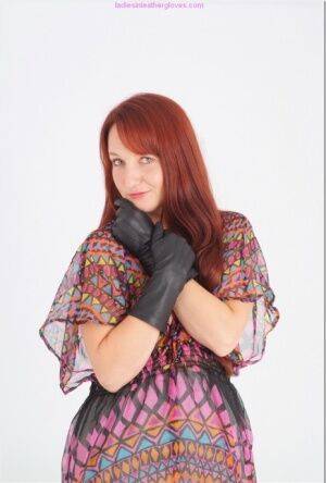 Natural redhead Sammy B model fully clothed in black leather gloves on picsofsex.com