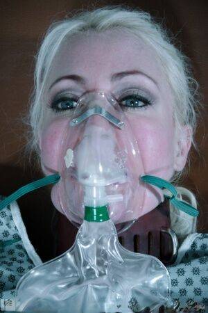 Blonde female Lorelei Lee ah her breathing restricted while in bondage on picsofsex.com