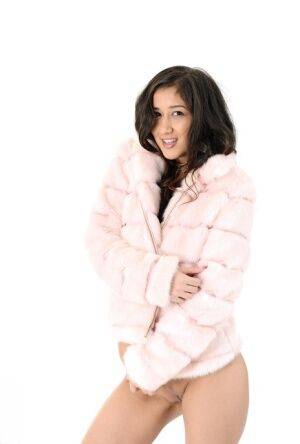 Brunette teen Darcia Lee doffs a fur coat and leggings before dildo riding on picsofsex.com