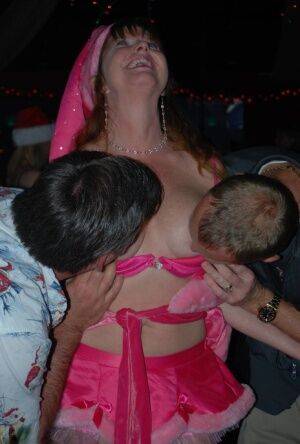 Mature lady Dee Delmar and friends hit the swing club for Christmas orgy on picsofsex.com