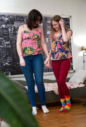 Sock and long sock attired amateurs Amber and Katherine J pulling on jeans on picsofsex.com