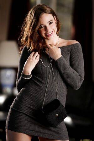 Clothed pornstar Jodi Taylor freeing flat chest and bush from slinky dress on picsofsex.com