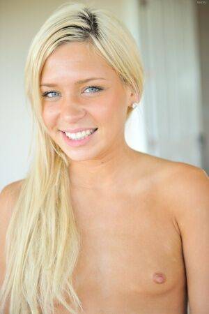 Sweet blonde teen plays with her labia lips before self fisting her pussy on picsofsex.com