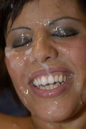 Latina slut Scarlett March gets her face covered in sperm during a gangbang on picsofsex.com