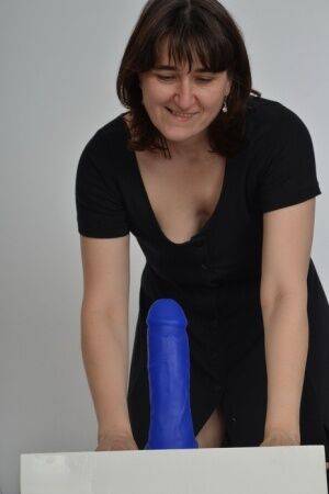 Amateur slut with saggy boobs riding a big blue dildo so damn good on picsofsex.com