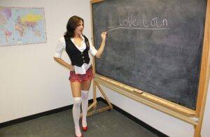 Naughty schoolgirl Cherry Poppins seduces a fellow student in slut wear on picsofsex.com