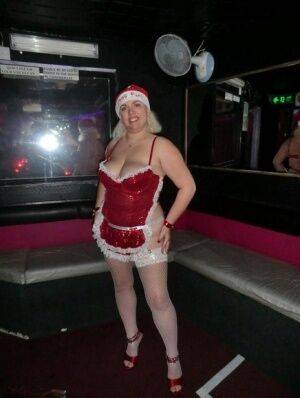 Older blonde Barby looses her tits and twat from Christmas lingerie on picsofsex.com