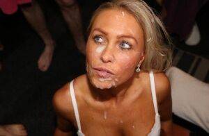 White slut Kelly Myers is left with a cum covered face at a bukkake party on picsofsex.com