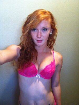 Natural redhead Alex Tanner slips off her pink lingerie set for nude selfies on picsofsex.com