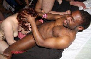 Amateur individuals take part in an interracial group sex scene on picsofsex.com