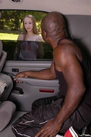 Slutty chick with slippy curves goes down on a black shlong on the back seat on picsofsex.com