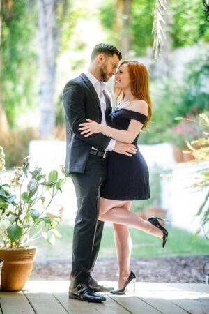 Pale redhead Ella Hughes seduces her man in a short black dress and heels on picsofsex.com