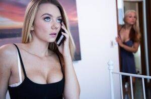 Blonde woman coerces her stepdaughter into having lesbian sex on a bed on picsofsex.com