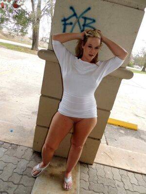 Blonde amateur Dee Siren exposes herself outside an underground parking lot on picsofsex.com