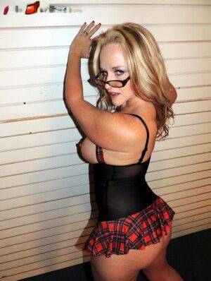 Thick blonde amateur Dee Siren holds her big tits while working her big butt on picsofsex.com