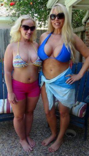 Thick blondes Karen Fisher & Dee Siren loose their big boobs from bikini tops on picsofsex.com