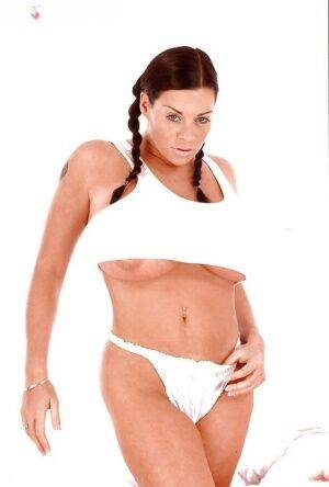 Big tits MILF Linsey Dawn McKenzie demonstrates huge bubbles and trimmed twat on picsofsex.com