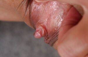 Horny brunette Mega Clit exposing her perfectly formed pink labia on picsofsex.com