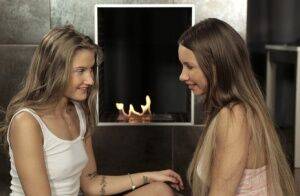 Teen lesbians Taylor Sands & Tiffany Tatum 69 on a rug in front of a fireplace on picsofsex.com