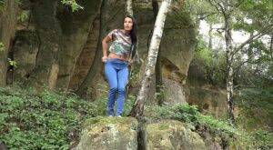 Brunette Lexi gets short taken and has to remove her jeans to piss in the bush on picsofsex.com