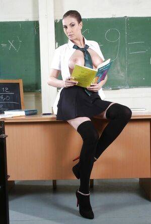 Uniformed schoolgirl Connie Carter is posing in sexy high heels on picsofsex.com