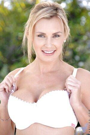 Luxurious blond mom Tanya Tate revealing her stunning assets from panties outdoor on picsofsex.com
