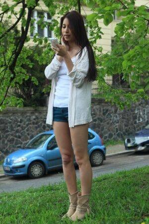 Young brunette awaits an open mouth cumshot after losing her virginity on picsofsex.com