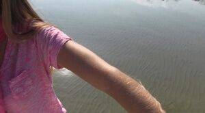 Amateur chick Lori Anderson shows off incredibly hairy forearms by the water on picsofsex.com