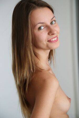 Sweet teen Lucia D peels off a black bodysuit before folding back labia lips on picsofsex.com