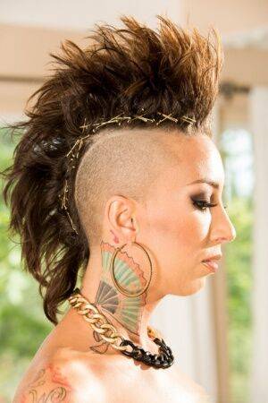 Solo model Bella Bellz flaunts her tattooed ass with hair in a mohawk cut on picsofsex.com